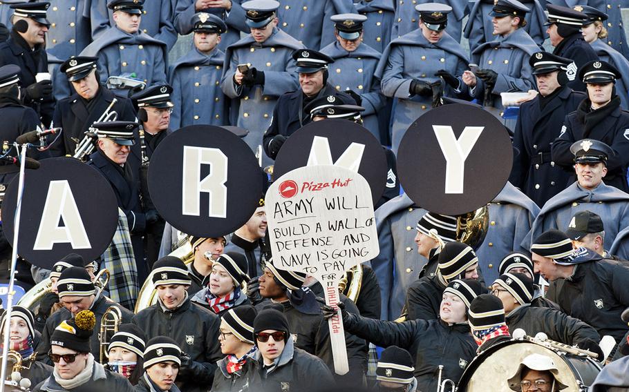 In a nod to fellow spectator President-elect Donald Trump, Army fans send a message to Navy during the Army-Navy game at M&T Bank Stadium in Baltimore, Md., Dec. 10, 2016. Army won, 21-17.