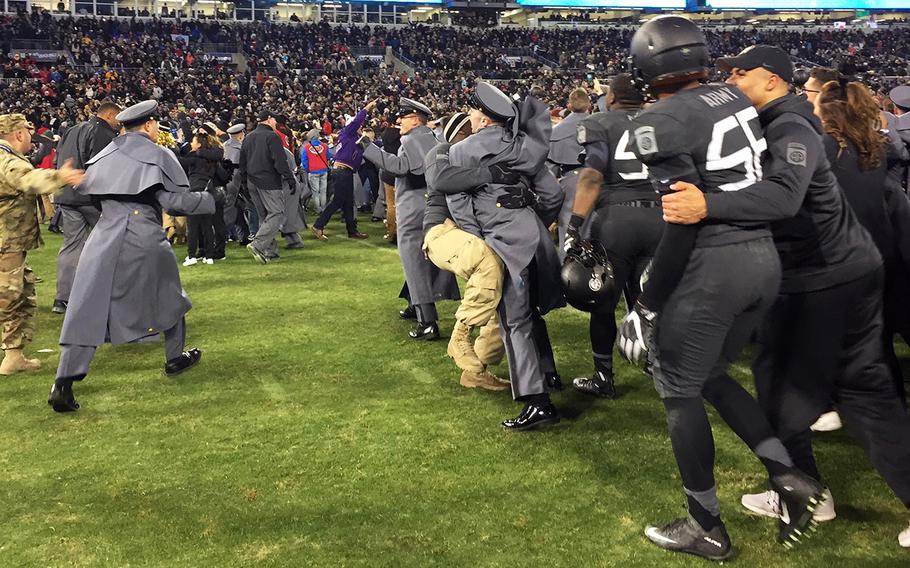 Army players and fans celebrate at the end of the Army-Navy game at M&T Bank Stadium in Baltimore, Md., Dec. 10, 2016. Army won, 21-17.