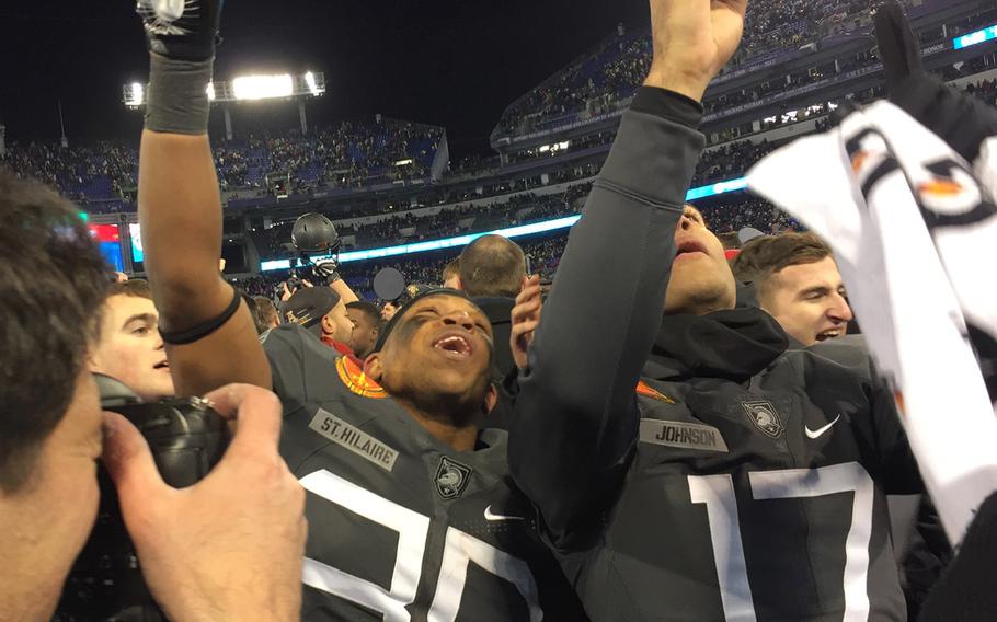 Army players celebrate at the end of the Army-Navy game at M&T Bank Stadium in Baltimore, Md., Dec. 10, 2016. Army won, 21-17.