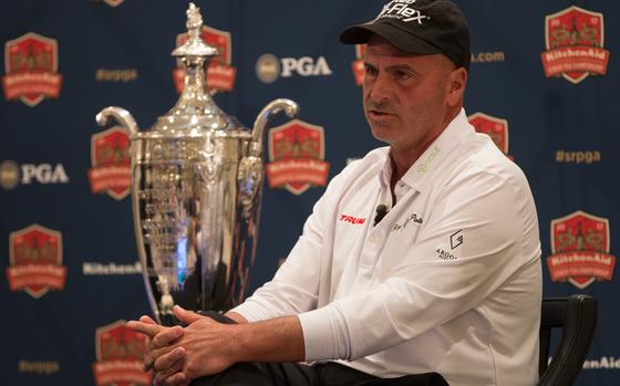 Rocco Mediate, defending champion of the Senior PGA Championship tournament, sits next to his trophy during a press conference for this year’s Senior PGA tournament, to be held at the Trump National Golf Club in Potomac Falls, Virginia. Mediate, along with PGA of America president Paul Levy and Eric Trump were spoke to members of the press from the Trump International Hotel in Washington on March 9, 2017. 