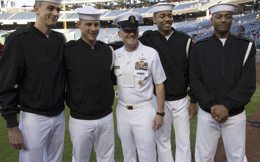 Sailors pose for a photo with Master Chief Petty Officer of the Navy Steven Giordano on U.S. Navy Day at Nationals Park in Washington, D.C., May 3, 2017.