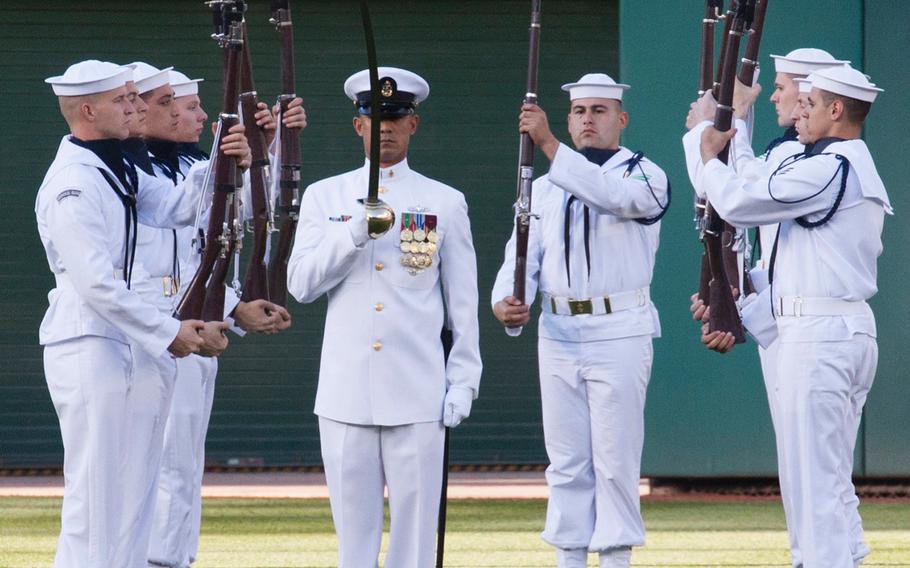 The U.S. Navy Ceremonial Guard drill team performs on U.S. Navy Day at Nationals Park in Washington, D.C., May 3, 2017.