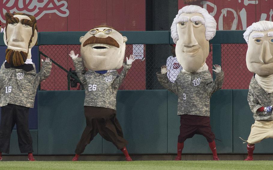 The Washington Nationals' president mascots, clad in appropriate uniforms for the occasion, on U.S. Army Day at Nationals Park in Washington, D.C., June 12, 2017.