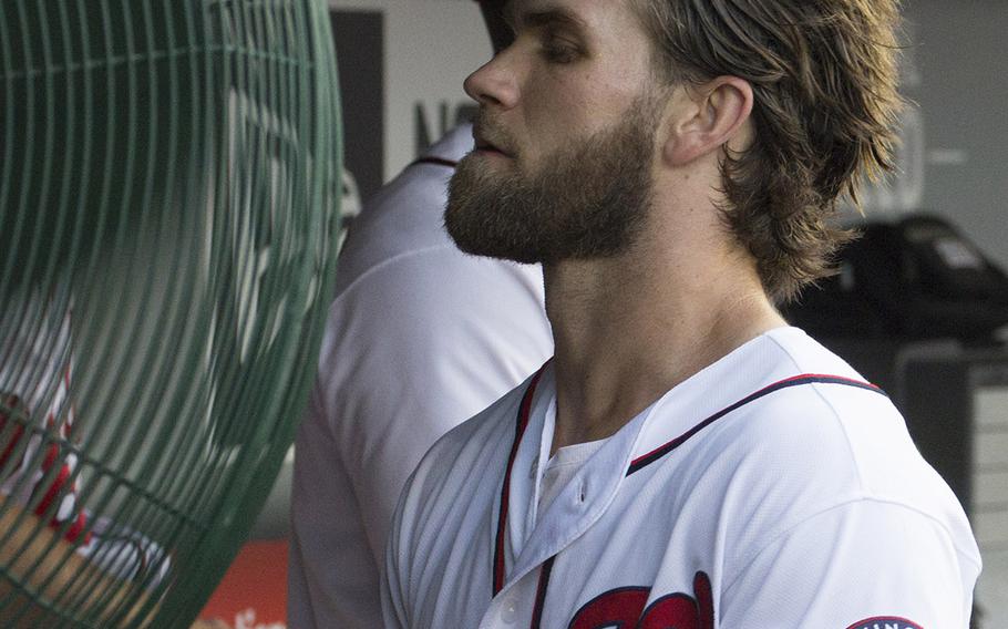 Washington Nationals outfielder Bryce Harper cools off between innings of a game against the Atlanta Braves at Nationals Park in Washington, D.C., June 12, 2017. The temperature at game time was 91 degrees.