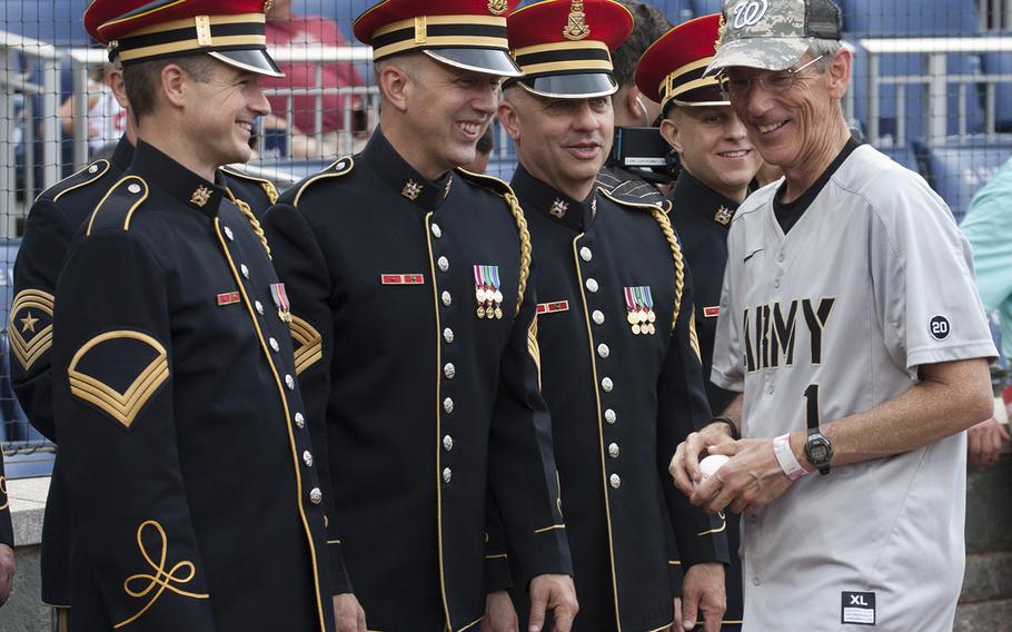 Acting Secretary of the Army Robert M. Speer talks with members of the Army Chorus of The United States Army Band on U.S. Army Day at Nationals Park in Washington, D.C., June 12, 2017.