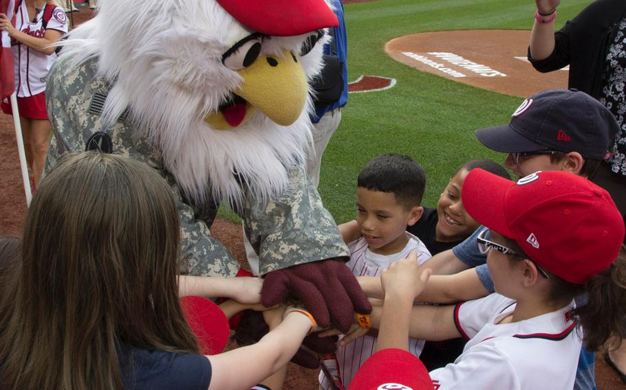 Washington Nationals mascot Screech talks with soldiers' children on U.S. Army Day at Nationals Park in Washington, D.C., June 12, 2017.