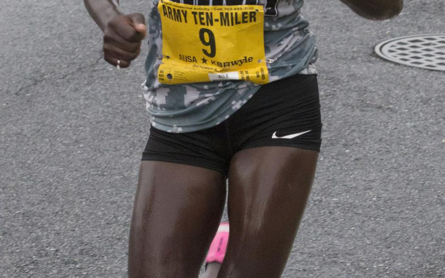 Army Spc. Susan Tanui, the eventual women's champion of the Army Ten-Miler, approaches the two-mile mark in Washington, D.C., Sunday, Oct. 8, 2017.
