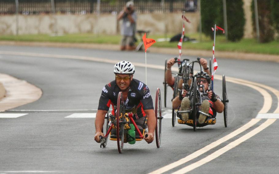 The first group of wounded servicemembers cross the finish line at the 33rd annual Army Ten-Miler in Washington, D.C., on Oct. 8, 2017.