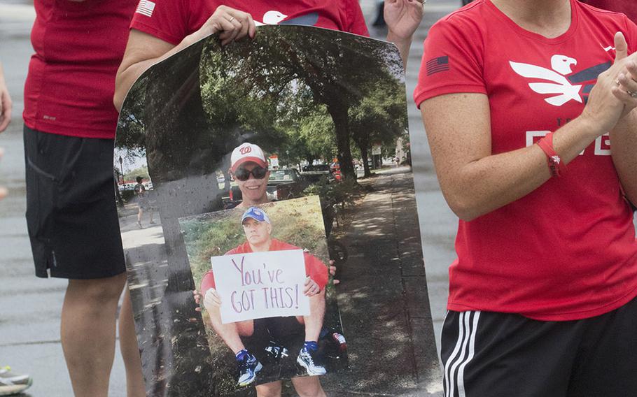 Spectators cheer the runners on during the Army Ten-Miler in Washington, D.C., Sunday, Oct. 8, 2017.
