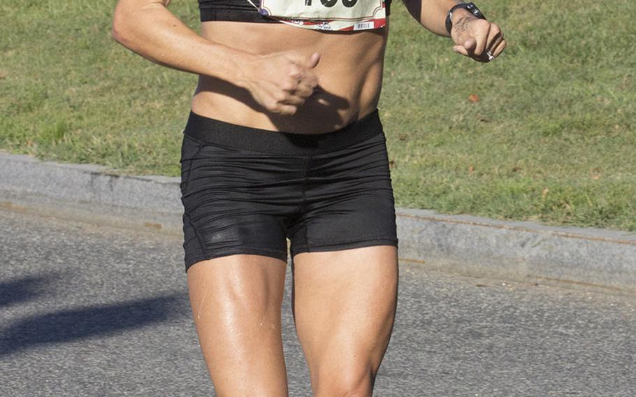 Sarah Bishop of Fairfax, Va., approaches the 17-mile mark on her way to a win in the women's division of the Marine Corps Marathon, Oct. 22, 2017 in Washington, D.C.