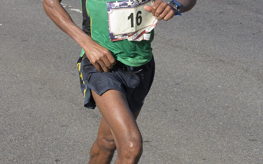 Desta Beriso Morkama of Arlington, Va., approaches the 17-mile mark on his way to a win in the men's division of the Marine Corps Marathon, Oct. 22, 2017 in Washington, D.C.