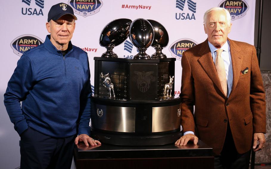 Two Heisman Trophy winners who played for the U.S. Naval Academy pose for a photo in Philadelphia on Dec. 8, 2017. Roger Staubach, left, won the honor in 1963 and Pete Dawkins was the 1958 winner.
