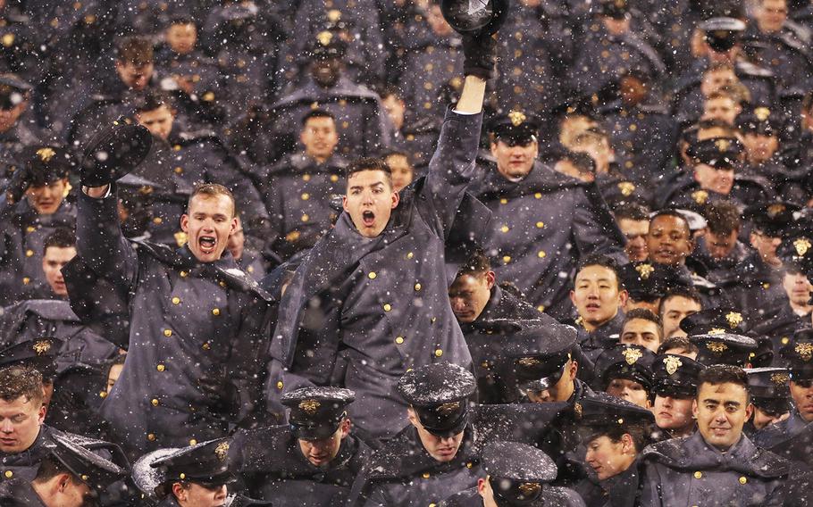 West Point cadets celebrate after the Black Knights beat the Midshipmen 14-13 for their second straight Army-Navy game victory.