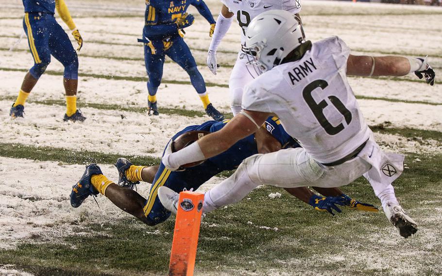 Army's John Trainor is driven out of bounds after scampering to the 1-yard line in the fourth quarter, giving the Black Knights the field position to punch in the winning touchdown. 