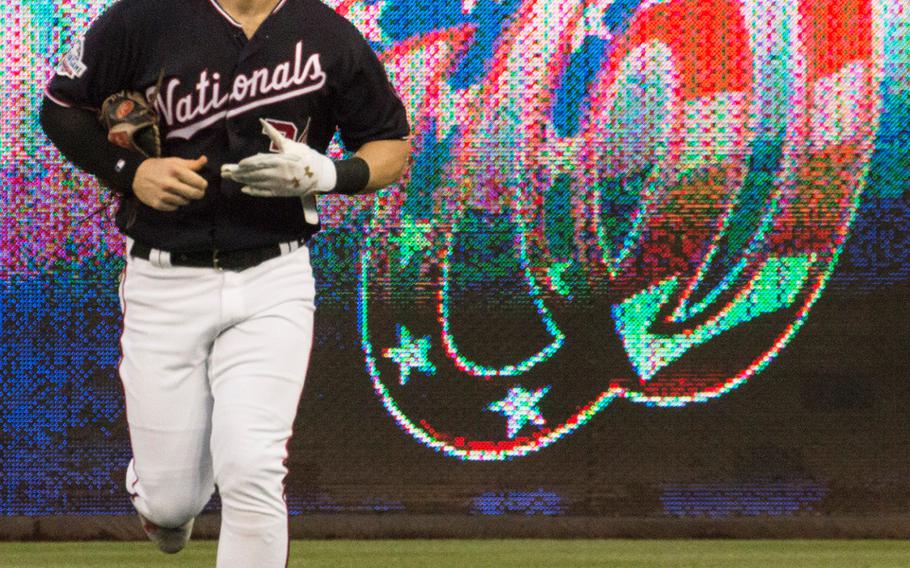 Washington Nationals right fielder Bryce Harper returns to the dugout at the end of an inning on May 22, 2018.