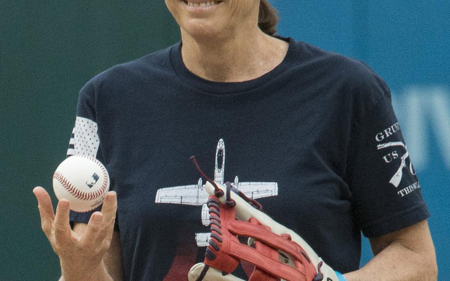 Sporting a t-shirt depicting an A-10 "Warthog" aircraft like the one she flew as an Air Force pilot, Rep. Martha McSally, R-Ariz., prepares to throw the ceremonial first pitch on Women in the Military Day at Nationals Park in Washington, D.C., May 22, 2018.