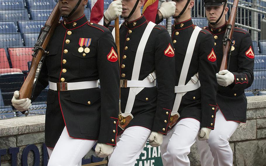 A U.S. Marine Corps color guard arrives for a ceremony before a Washington Nationals game on May 22, 2018.