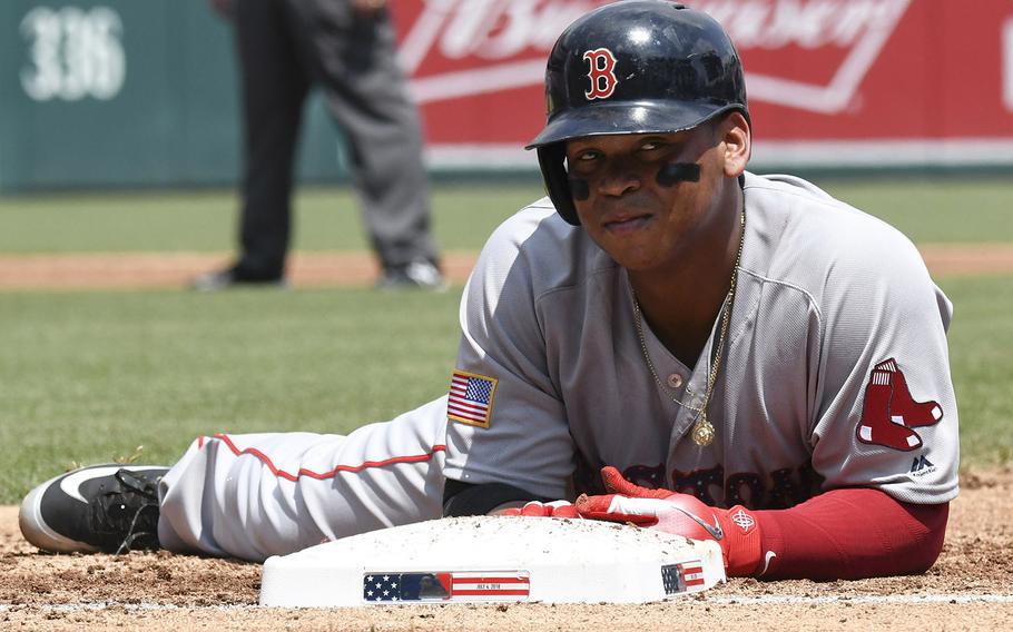 Boston Red Sox baserunner Rafael Devers reacts after being picked off first base in the second inning of a game against the Washington Nationals at Nationals Park in Washington, D.C., July 4, 2018.