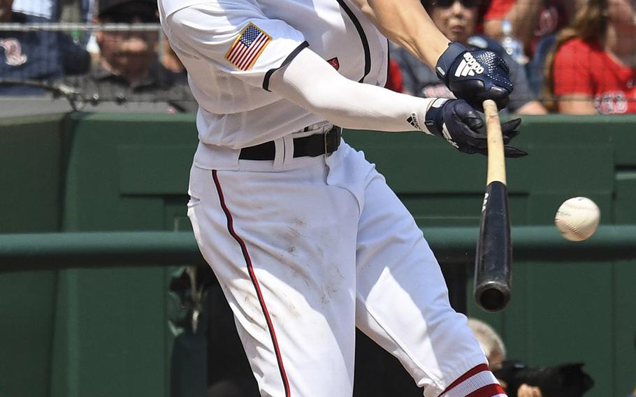 Trea Turner of the Washington Nationals connects for a first-inning single against the Boston Red Sox at Nationals Park in Washington, D.C., July 4, 2018.