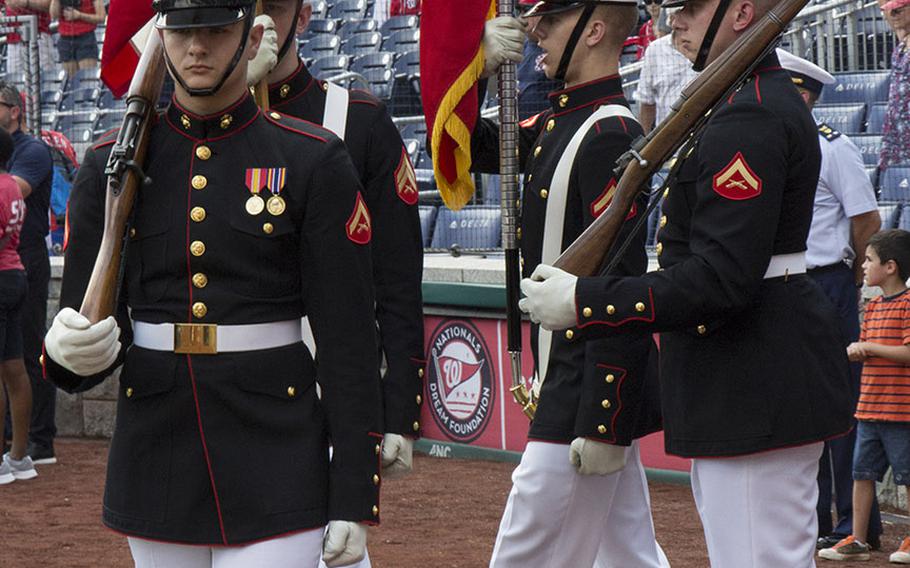 The U.S. Marine Corps color guard from Marine Barracks Washington leaves the field after the singing of the national anthem before a game between the Washington Nationals and Boston Red Sox in Washington, D.C., July 4, 2018.