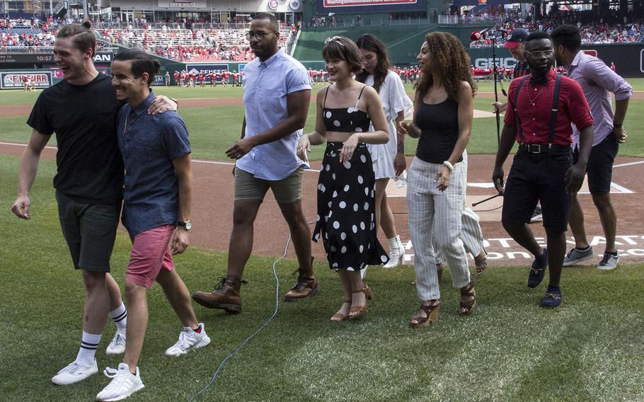 Members of the cast of "Hamilton" leave the field after singing the national anthem before a game between the Washington Nationals and Boston Red Sox in Washington, D.C., July 4, 2018.