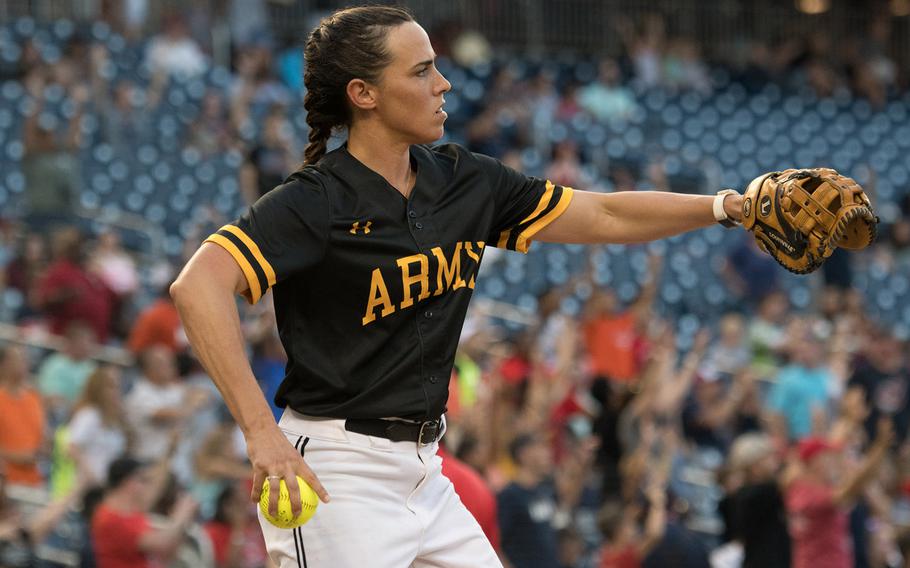 U.S. Army Capt. Kristina Gscheidle warms up in between innings at the 2018 Armed Forces Classic, a co-ed softball game held at Nationals Park in Washington on Friday, July 13, 2018.