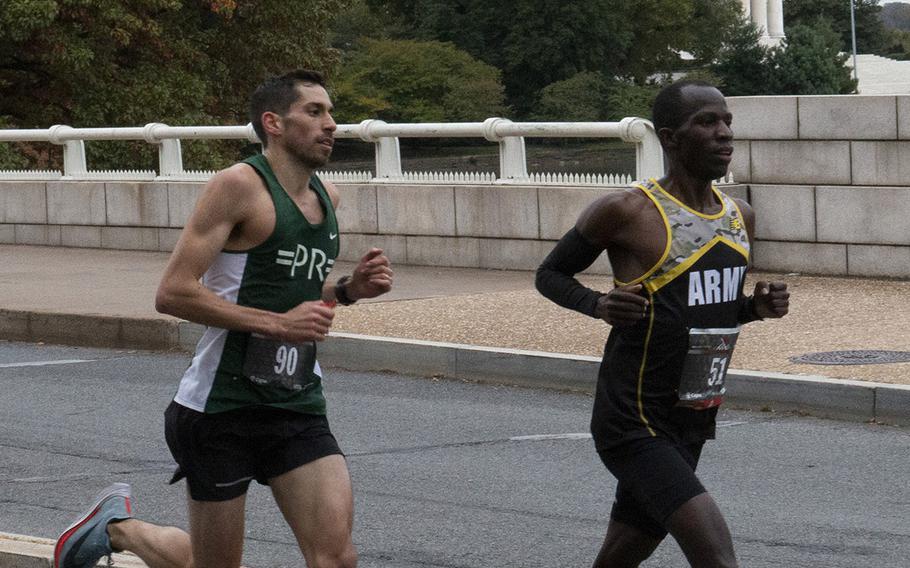 Eventual winner Jeffrey Stein, left, and fourth-place finisher Samson Mutua run past the Jefferson Memorial during the 43rd Marine Corps Marathon in Washington, D.C., Oct. 28, 2018.