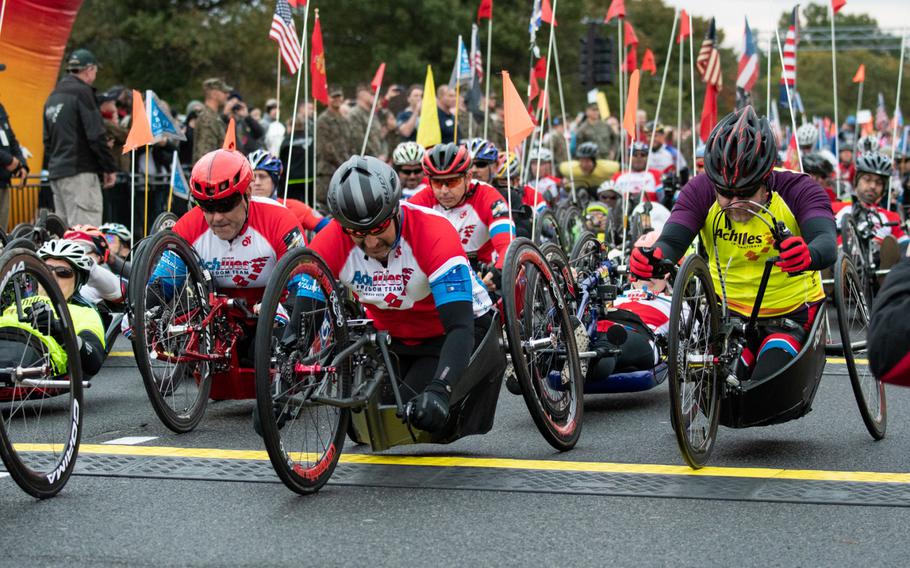 Handbike competitors take off at the start of the 43rd Annual Marine Corps Marathon, held throughout Washington, D.C., on Sunday, Oct. 28, 2018.