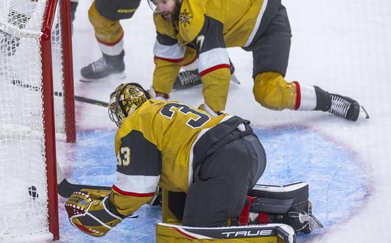 Vegas Golden Knights goaltender Adin Hill (33) has the puck slide by as teammate Alex Pietrangelo (7) watches in horror as the Florida Panthers' Eric Staal, not pictured, scores shorthanded in the first period during Game 1 of the Stanley Cup Finals at T-Mobile Arena on Saturday, June 3, 2023, in Las Vegas. 