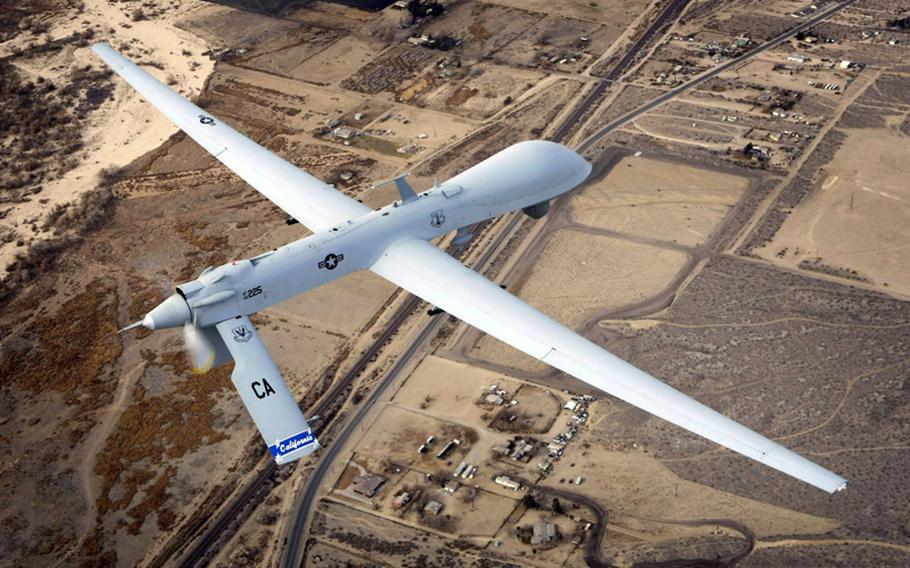 In this Jan. 9, 2010, file photograph, a Predator unmanned drone flies a training mission over Victorville, Calif.
