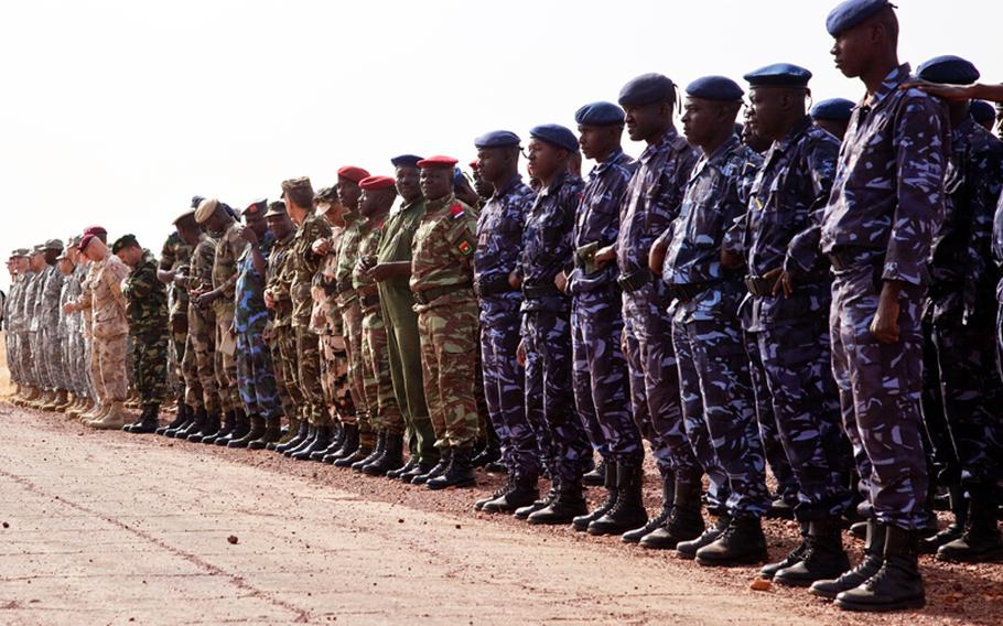 Servicemembers from the United States, Mali, Canada, Senegal, Uganda, Algeria and Tunisia attend the opening ceremony for the Atlas Accord 2012 exercise at the Mopti Airfield in Sevare, Mali, Feb. 9, 2012. The goal of Atlas Accord was to promote interoperability and aerial resupply for humanitarian aid.