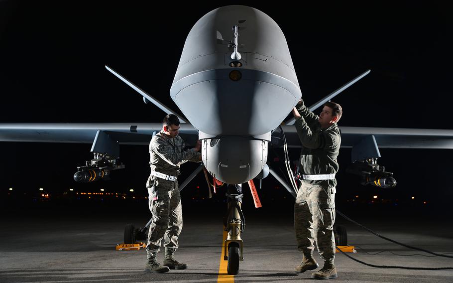 U.S. airmen prepare an MQ-9 Reaper for flight at Creech Air Force Base, Nev., on May 15, 2014.