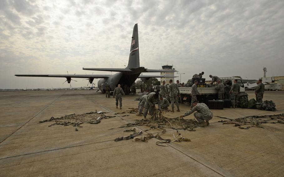 U.S. Army soldiers with Combined Joint Task Force-Horn of Africa's East Africa Response Force unload gear and supplies from a U.S. Air Force C-130J Hercules in Juba, South Sudan in January 2014. The U.S. military says it has sent 40 soldiers to the city to help secure American personnel and facilities. 