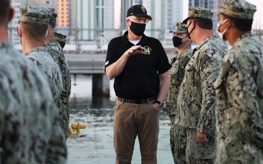 Acting Defense Secretary Christopher Miller speaks with sailors of Commander Task Force 56 on the waterfront at Naval Support Activity Bahrain Nov. 25, 2020. Miller is visiting troops in the Middle East for the Thanksgiving holiday.