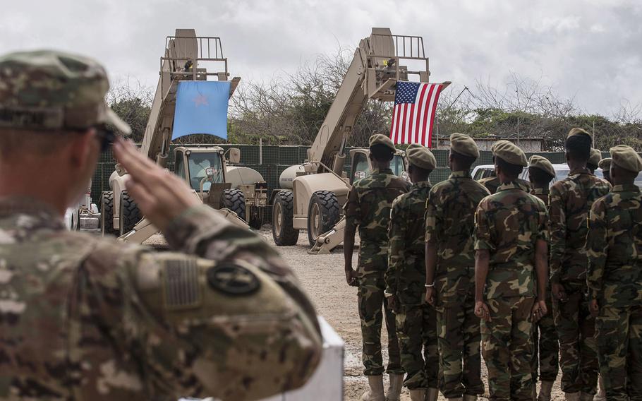 In an August, 2018 photo, Somali national army soldiers stand in formation during a logistics course graduation ceremony.  Soldiers from Somalia's advanced infantry DANAB battalion spent 14 weeks training with the U.S. 10th Mountain division on the importance of logistical operation as well as the operation and maintenance of heavy equipment.