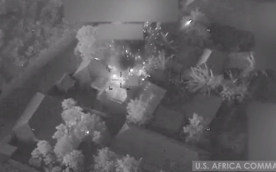 A screenshot from a video shot by U.S. Africa Command shows airstrikes on an al-Shabab compound near the town of Qunyo Barrow in Somalia on Jan. 1, 2021. Three al-Shabab militants were killed in the strikes and six buildings were destroyed, AFRICOM said in a statement.