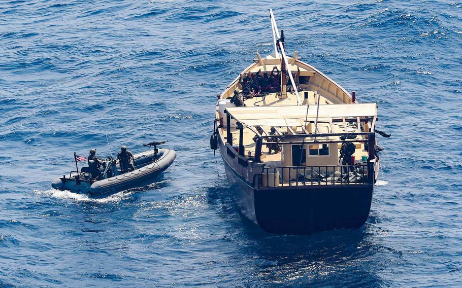 Service members from the destroyer USS Winston S. Churchill board a stateless dhow off the coast of Somalia and interdict an illicit shipment of weapons and weapon components, Feb. 12, 2021.
