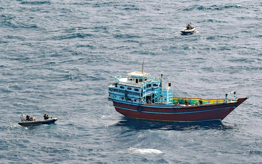 Service members from the destroyer USS Winston S. Churchill board a stateless dhow off the coast of Somalia and interdict an illicit shipment of weapons and weapon components, Feb. 12, 2021. 