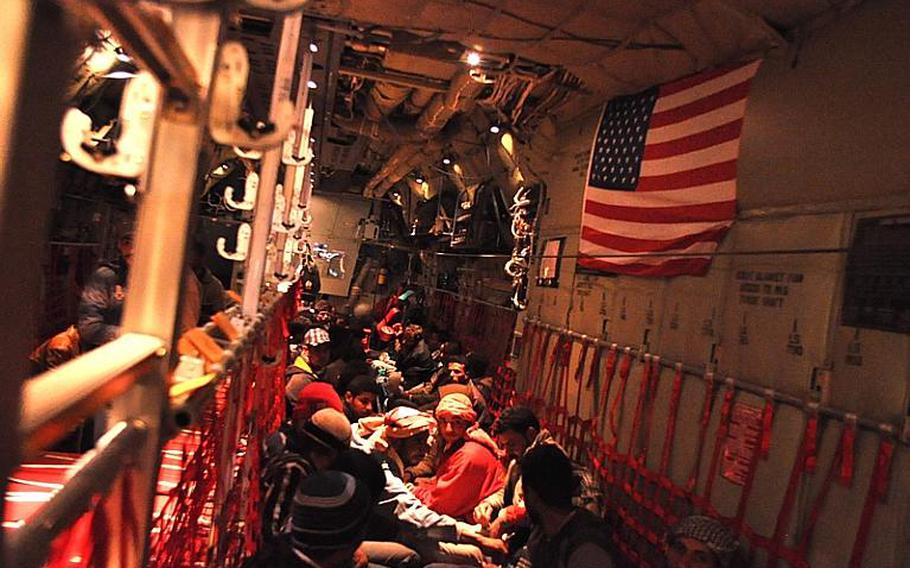 Egyptian refugees, who fled the conflict in Libya, pack a row of canvas seats on an Air Force C-130 transport plane at Djerba-Zarzis International Airport in Tunisia. Nearly 650 Egyptians were flown home on eight U.S. military flights this past weekend, as part of an international effort to repatriate the tens of thousands of refugees fleeing the escalating bloodshed in Libya.
