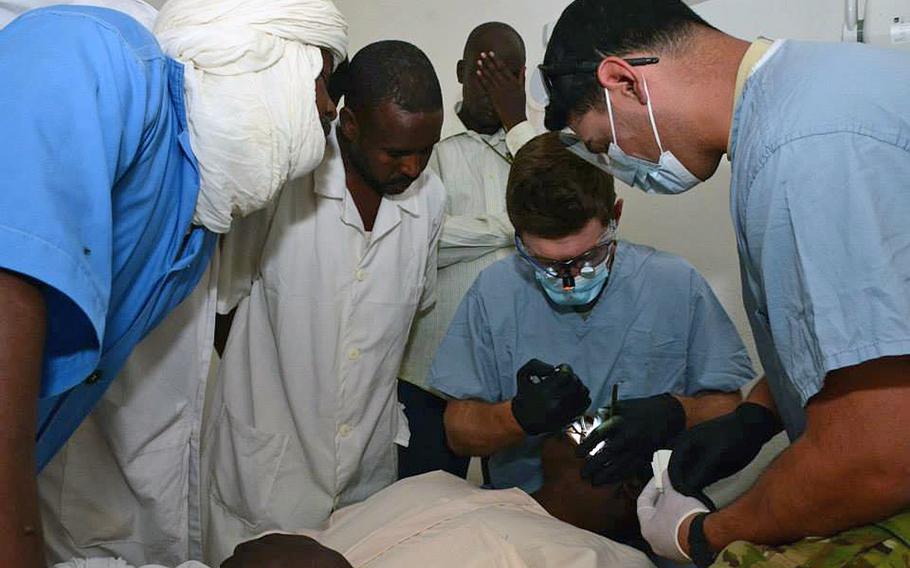 U.S. Army Capt. Ross Cook, a dentist, and Sgt. Luis Hernandez, a dental technician, 10th Special Forces Group (Airborne), instruct nurses how to perform a tooth extraction in Faya, Chad, Feb. 19, 2015. Ross and Hernandez are in Chad as part of the Flintlock 2015 exercise, an annual, African-led military exercise focused on security, counterterrorism and military humanitarian support to outlying areas.
