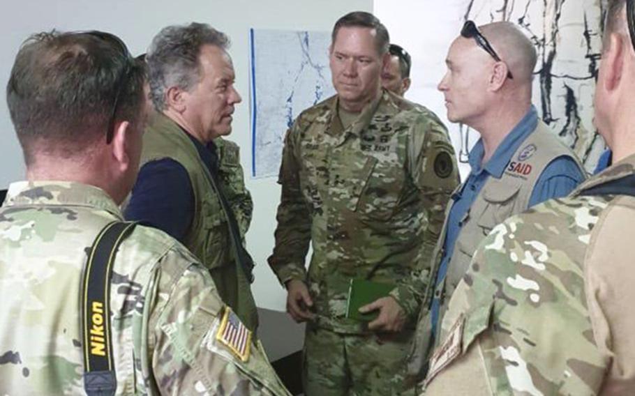 U.S. Army Maj. Gen. James D. Craig, center, Combined Joint Task Force Horn of Africa commander, talks with staff from the U.S. Agency for International Development about getting aid to people affected by Cyclone Idai in Mozambique.