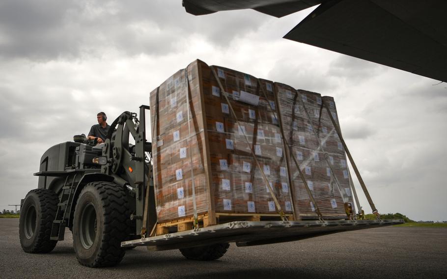 Air Force Master Sgt. Patrick Wagnon, assigned to Combined Joint Task Force-Horn of Africa, unloads a World Food Program pallet from a C-130J Hercules at Maputo International Airport, Mozambique, March 30, 2019, for the relief effort in Mozambique and surrounding areas following Cyclone Idai.
