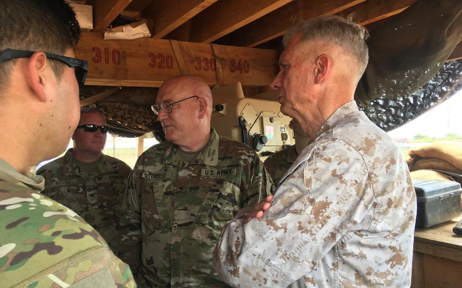 Marine Gen. Thomas D. Waldhauser, commander of U.S. Africa Command, and Brig. Gen. Michael D. Turello, incoming commander of the Combined Joint Task Force-Horn of Africa, get an operations update at an undisclosed forward operating location in Somalia on Tuesday, June 11, 2019.