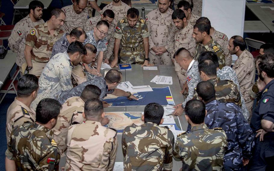 Military personnel from several nations plan a simulated joint operation off the southern coast of Oman as part of International Maritime Exercise, at Naval Support Activity, Bahrain on October 24, 2019. The exercise will continue through mid-November.