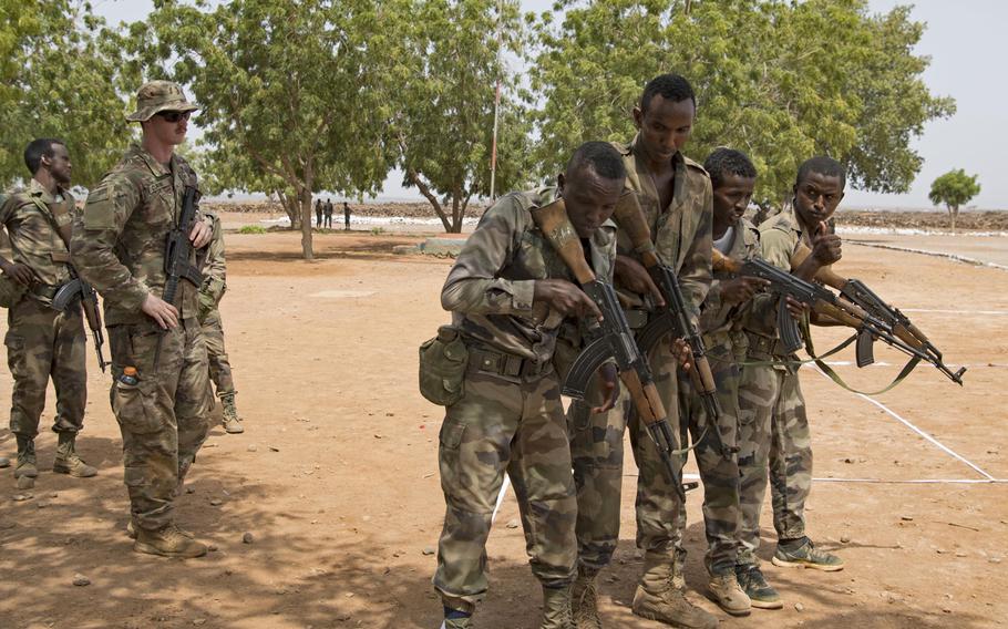 U.S. soldiers with the Massachusetts Army National Guard train soldiers with the Rapid Intervention Battalion, a Djiboutian army elite military force, near Djibouti City, Djibouti, June 2019. 