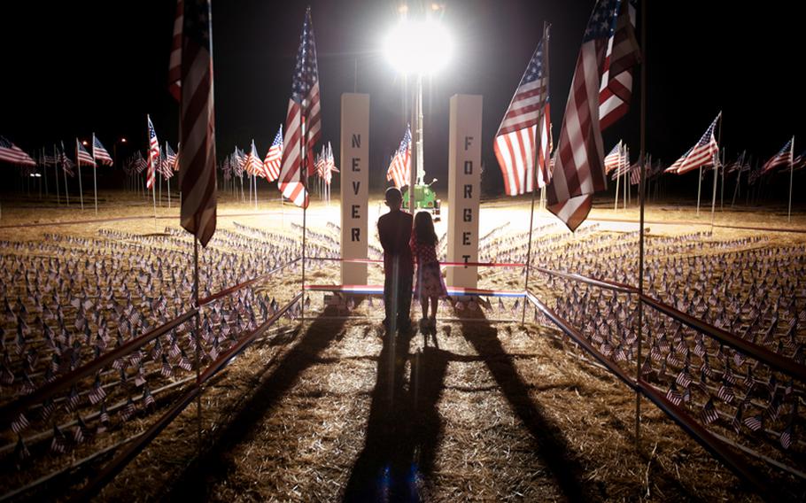 Ludwig Camacho, 8, left, and Annbelle Camacho, 5, of West Sacramento, view the Twin Towers site at the September 11 Memorial on Jefferson Blvd and South River Road in West Sacramento, California, September 10, 2012.