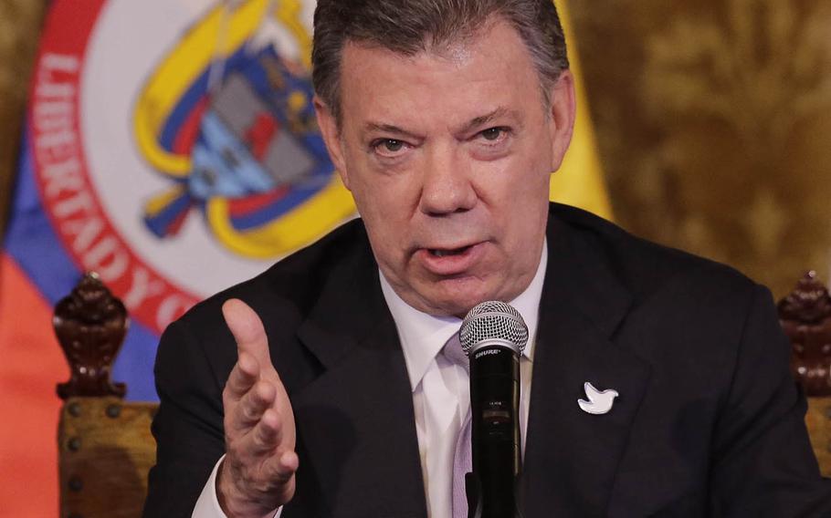 FILE - In this Sept. 21, 2015, file photo, Colombia's President Juan Manuel Santos talks in Quito, Ecuador. Santos acknowledged on Wednesday, March 9, 2016, that his government may not be ready to sign a peace deal with rebels to end the country’s decades-long civil war by March 23.  