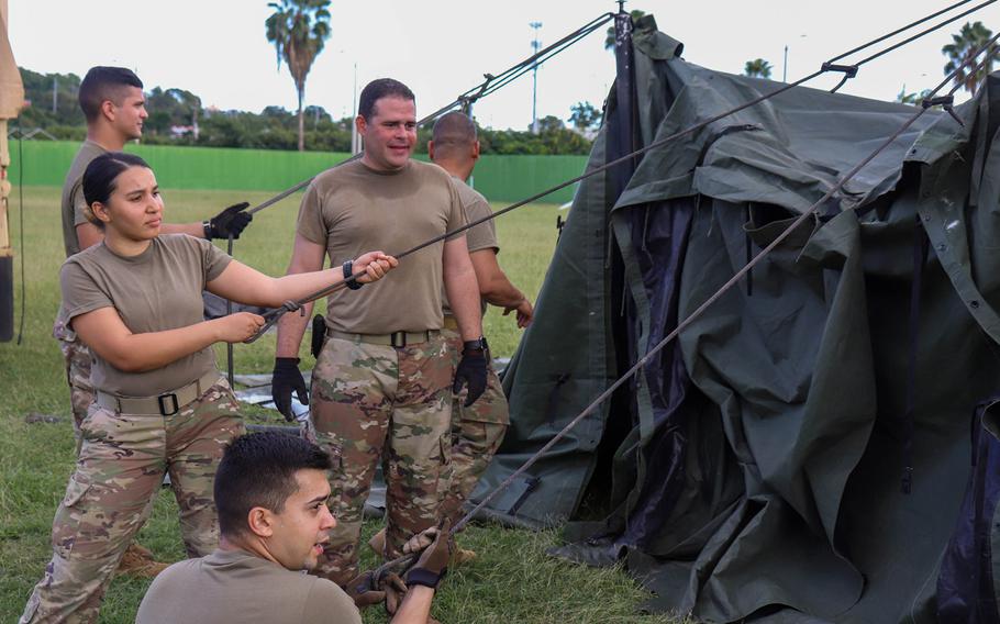 Members of the Puerto Rico National Guard's 105th Quartermaster Company of the 3678th Combat Sustainment Support Battalion erect tents Wednesday, Jan. 7, 2020, following a 6.4-magnitude earthquake that shook the southern half of the island Tuesday.