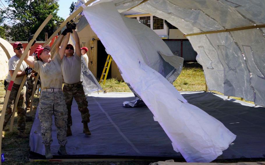 Members of the Ohio Air National Guard set up a disaster relief bed-down set in Guayanilla, Puerto Rico, on Jan. 19. Troops are assisting the Puerto Rico Housing Department with logistics and support for clean beds, necessary supplies, power, shower and laundry capabilities and limited medical care for displaced citizens in five base camps established in municipalities across southern Puerto Rico following the 6.4-magnitude earthquake near the coast of Guanica.