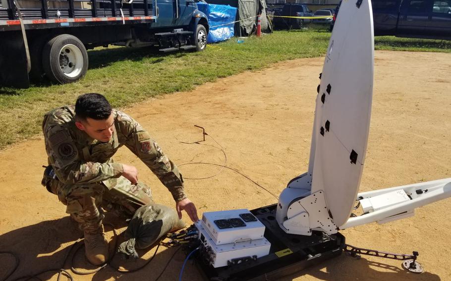 Air Force Staff Sgt. Kelvin Matos with the 156th Communications Flight powers up the SATCOM Hawkeye II satellite dish to provide voice, data, network and commercial internet capabilities at the Guanica tent city to support Task Force South and the displaced citizens affected by the earthquakes that shook the island in early January 2020. 